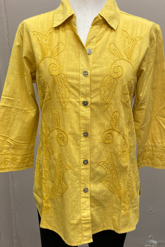 Vintage collared mustard shirt with embroidered embellishment.  3/4 sleeve with cuff and slits..  Antique button front with back pleat .